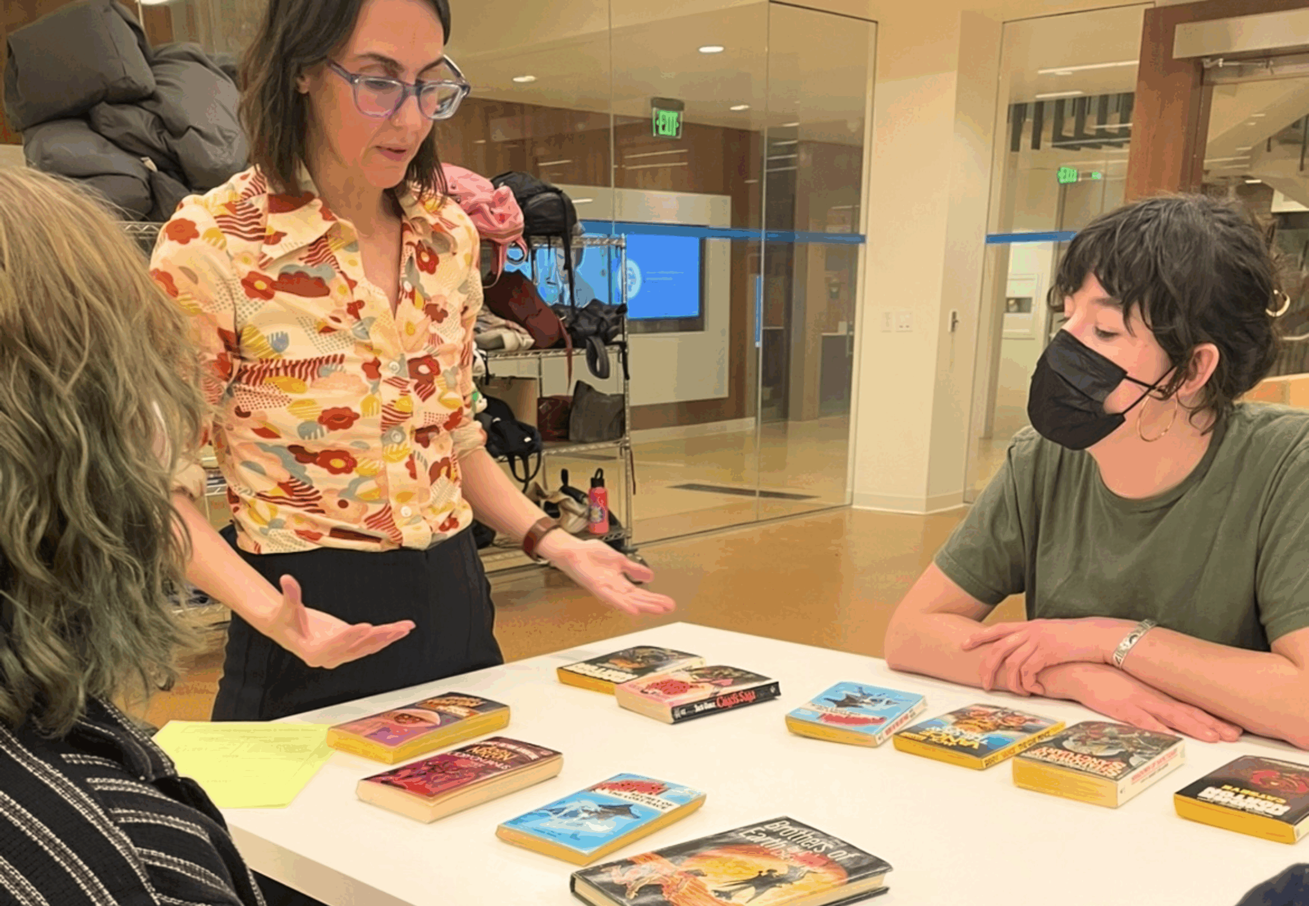 Jet Jacobs, head of public services, outreach and community engagement and interim assistant director of UCLA LSC discusses sci-fi pulp novels with students