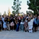 Group photo of SRLC attendees. 30 or so people smile and hold their fists up in solidarity.
