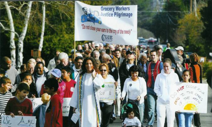 Clergy and Laity United for Economic Justice (CLUE) leads a Grocery Workers Justice Pilgrimage during the Southern California supermarket strike of 2003-2004. At the front of the march is Rev. Alexia Salvatierra. LAANE Collection, IRLE Archives.