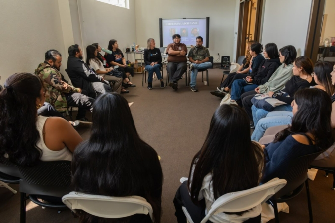 Students sit in chairs arranged in a circle during “Careers in Labor” panel discussion hosted with student fellows during the 2025 Labor Summer fellowship closing retreat.