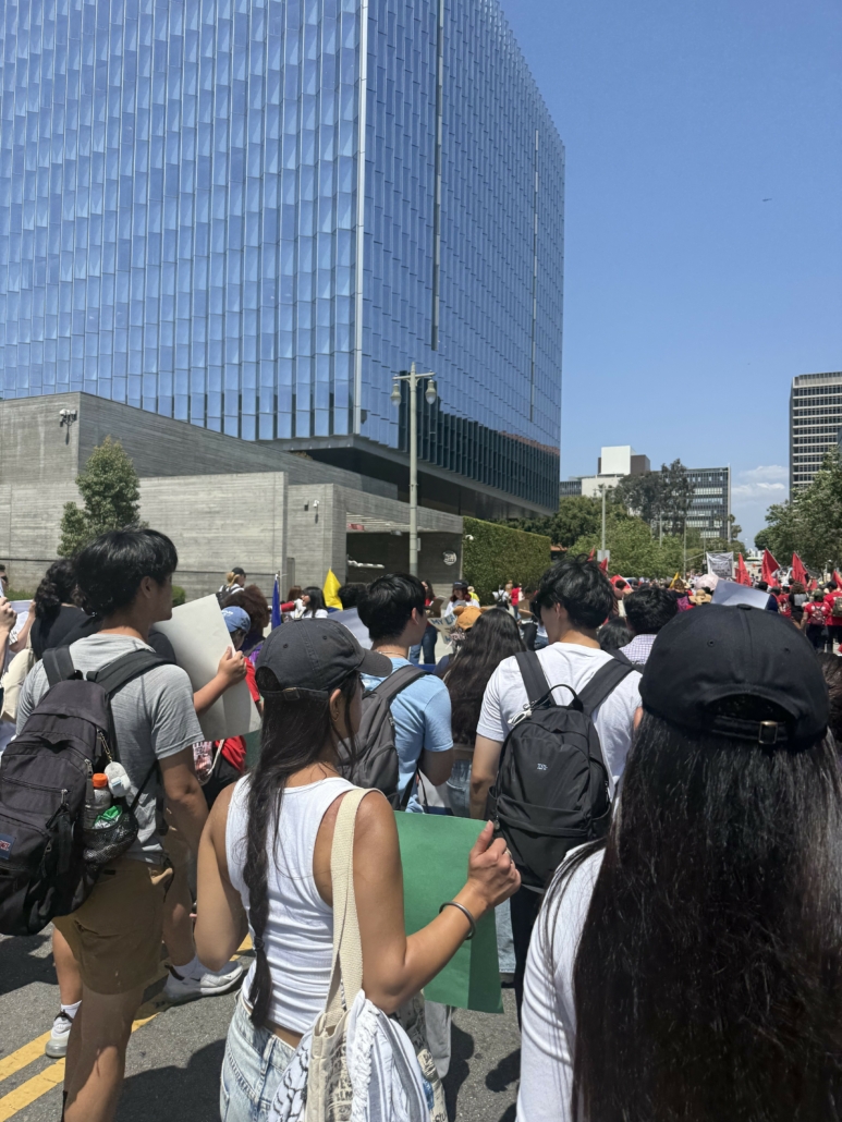 Point of view image from the UCLA Labor Studies contingent marching through Downtown Los Angeles / UCLA Labor Studies