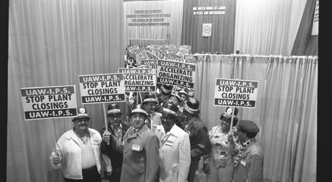 United Auto Workers delegates with pickets reading 