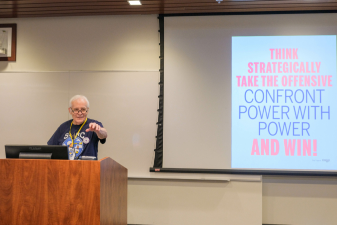 Activist Ray Roger addresses the audience during his plenary session